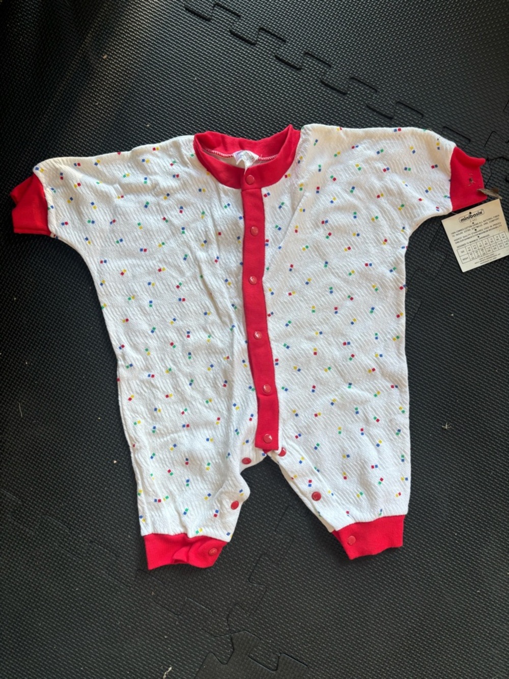 Baby Footie One-Piece in White with Red Trim and Multicolor Dots